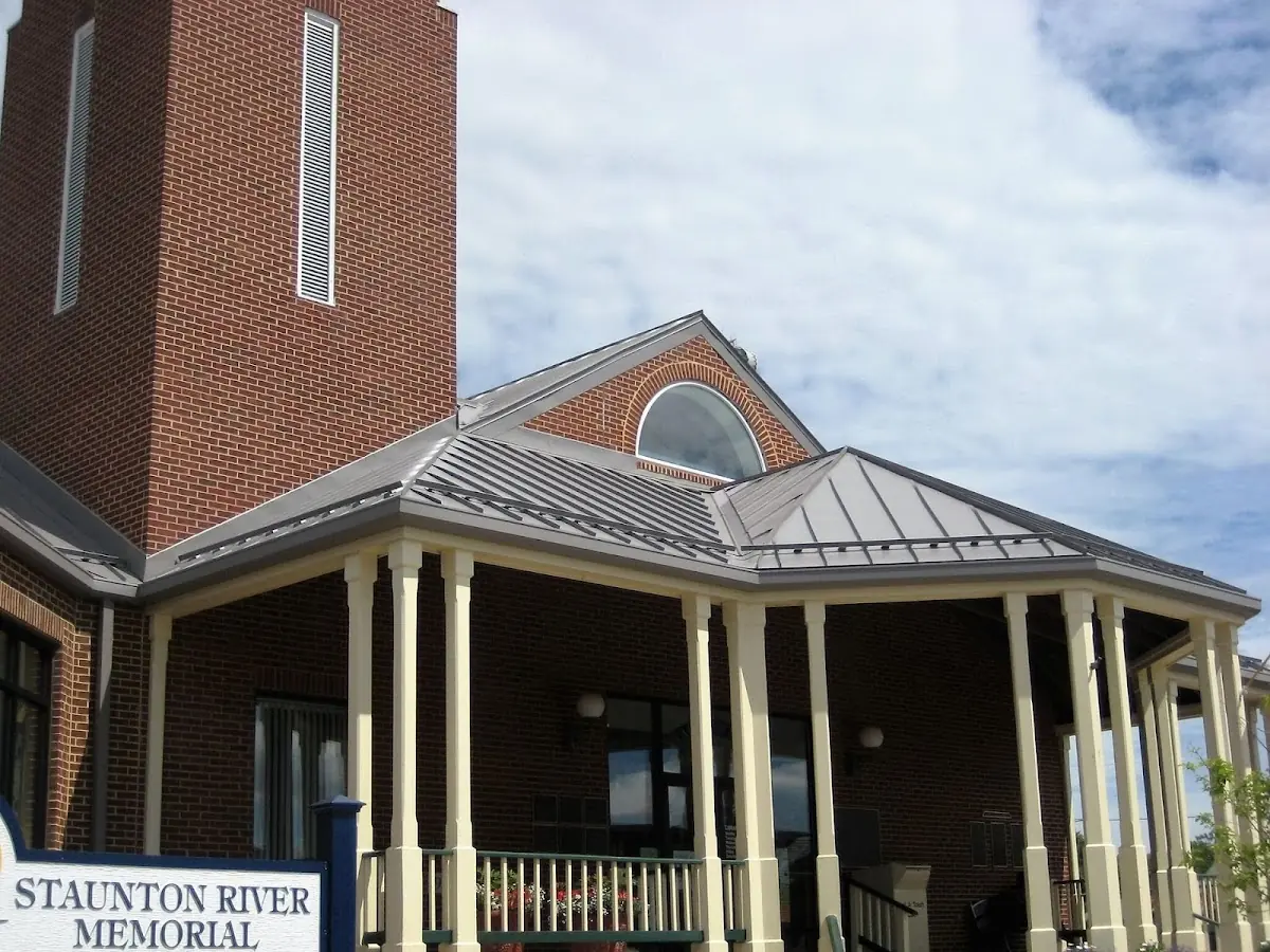 Skilled roofing craftsmen working on a residential roof in Platteville